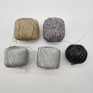Assorted metallic fingering weight yarn.